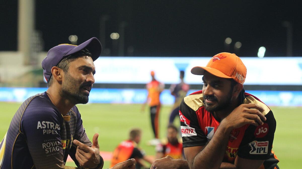 Dinesh Karthik (left) and Vijay Shankar of Sunrisers Hyderabad have a chat during last season's IPL in the UAE. — BCCI/IPL