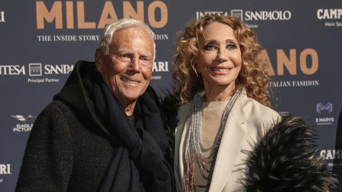 Giorgio Armani with actress Marisa Berenson at the premiere