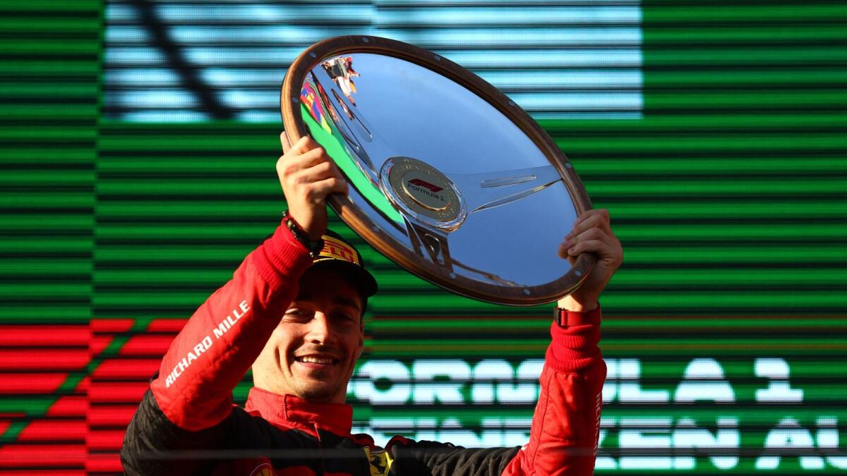 Charles Leclerc celebrates on the podium. (Reuters)