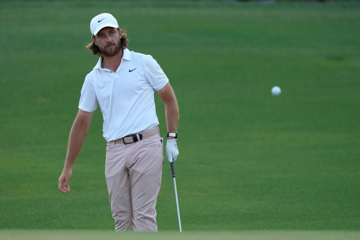 England's Tommy Fleetwood watches his shot at  the DP World Tour Championship. - AP