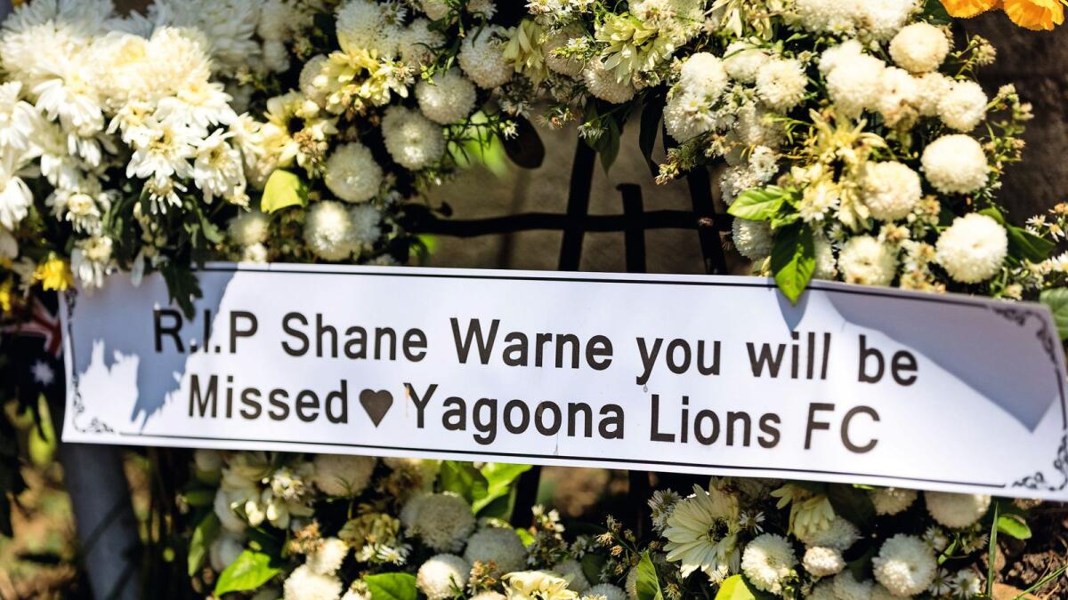 In loving memory: Tributes to the late Shane Warne are seen outside the luxury resort Samujana Villas in Thailand’s Koh Samui on Monday. — AFP