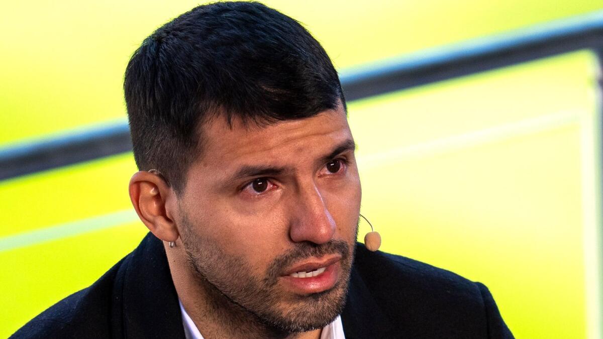 Barcelona striker Sergio Aguero cries during a press conference at the Camp Nou in Barcelona on Wednesday. — AP