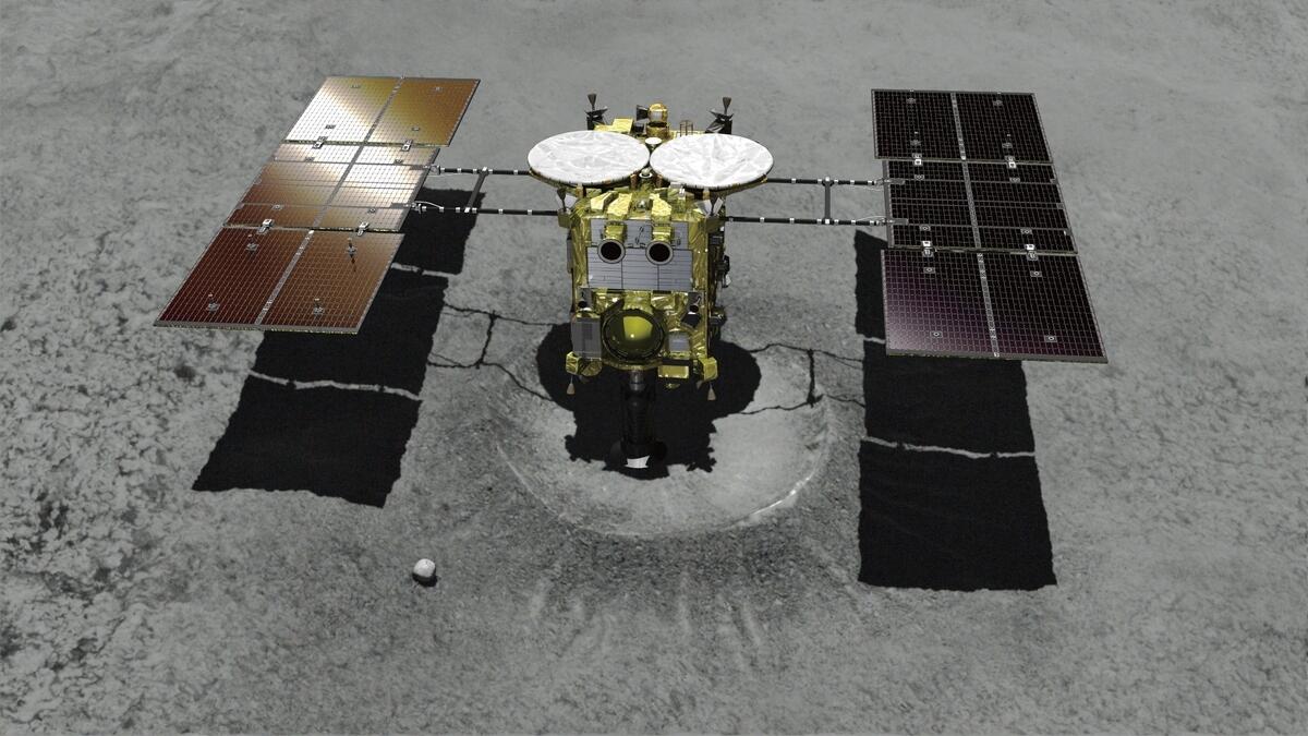 Japanese spacecraft lands on asteroid, takes samples
