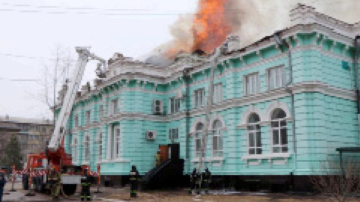 Firefighters work to extinguish a fire at a local clinic of cardiac surgery in the city of Blagoveshchensk, Russia. — Reuters