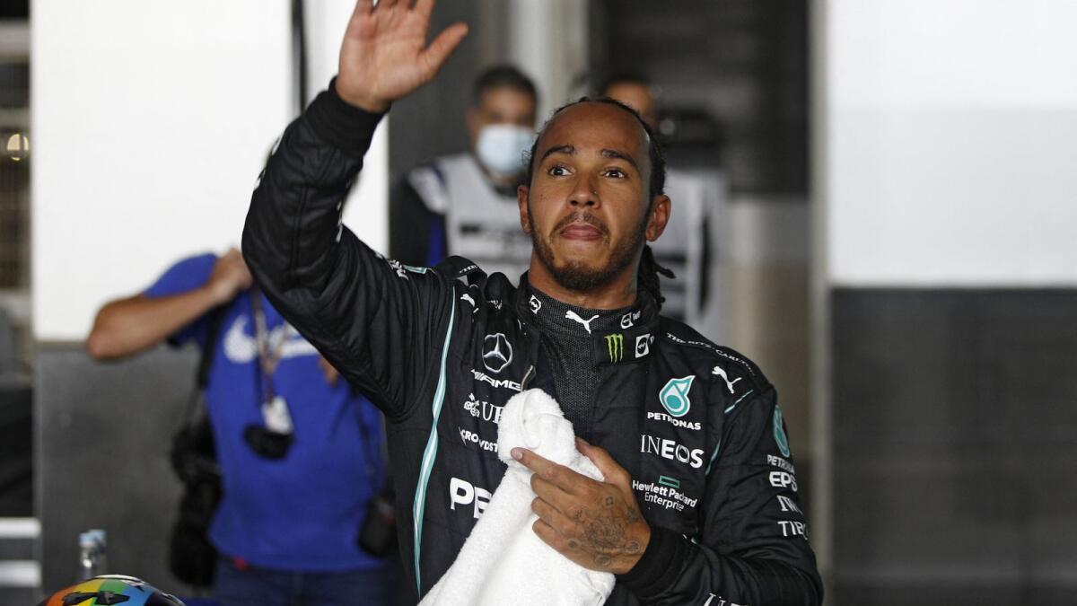Mercedes' British driver Lewis Hamilton celebrates after the qualifying session at the Qatar Formula One Grand Prix. (AFP)