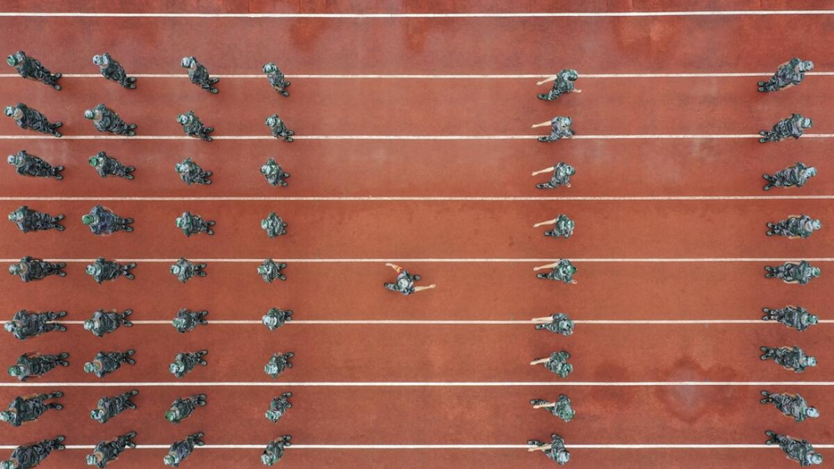 This aerial photo taken shows high school students taking part in a military education and training session ahead of the new semester in Yongzhou in China's central Hunan province. Photo: AFP