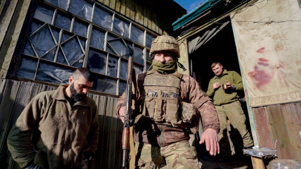 A Ukrainian serviceman leaves a command post to start his shift at a frontline position outside Popasna, in the Luhansk region, eastern Ukraine. — AP