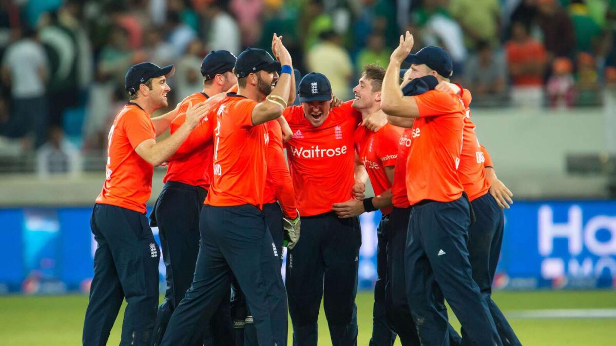 England’s team members celebrate their victory over Pakistan in the second T20 match at the Dubai International Cricket Stadium on Friday. 