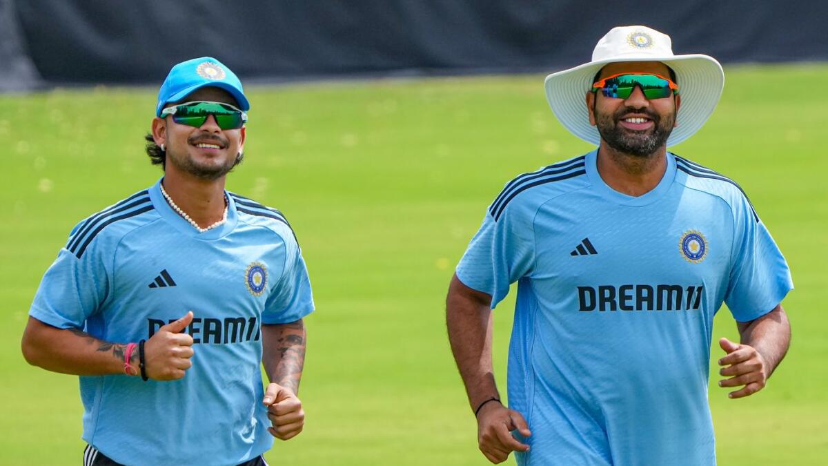 Indian cricket team captain Rohit Sharma (R) with teammate Ishan Kishan during a training session ahead of Asia Cup. - AFP