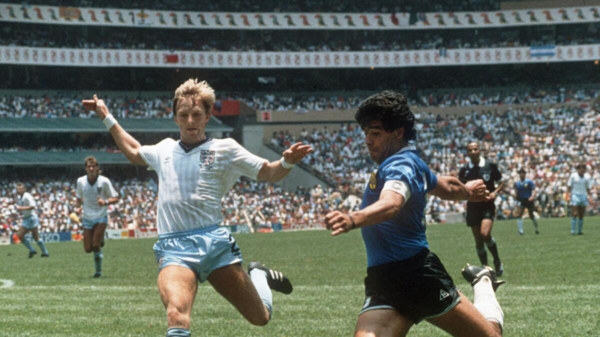 In this file photo taken on June 22, 1986, Argentina's forward Diego Maradona (right) gets ready to cross past England defender Gary Stevens during the World Cup quarterfinal. — AFP