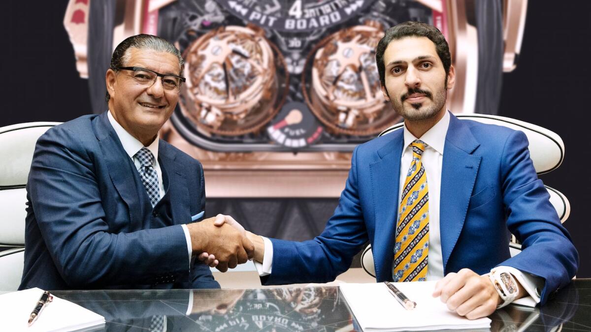 Muhammad Binghatti and Jacob Arabo shaking hands after signing the deal.