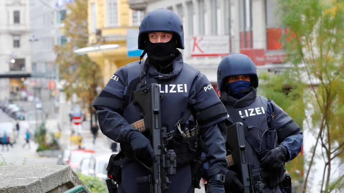 Armed police officers patrol near the site of a gun attack in Vienna, Austria, November 4, 2020.