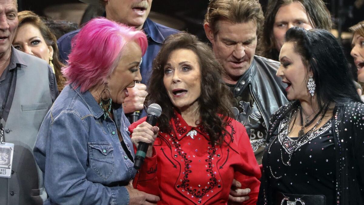 Loretta Lynn, center, Tanya Tucker, left, and Crystal Gayle perform at Lynn's 87th Birthday Tribute at Bridgestone Arena on Monday, April 1, 2019