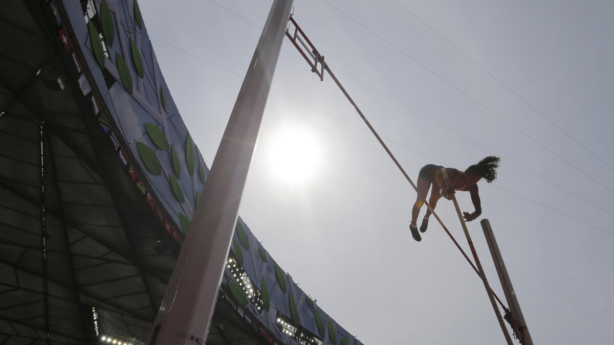 Sweden's Angelica Bengtsson makes a clearance in women's pole vault qualification at the World Athletics Championships at the Bird's Nest stadium in Beijing, Monday, Aug. 24, 2015.