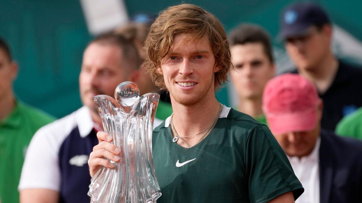 Andrey Rublev of Russia poses with trophy. (AP)