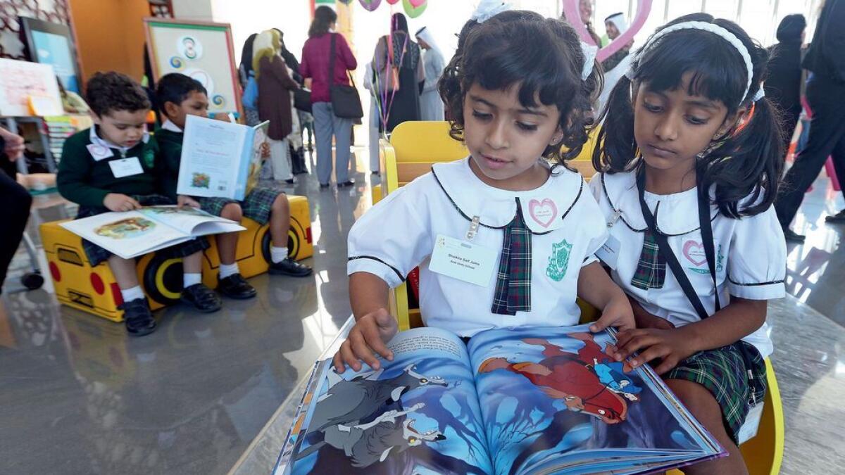 Students read a comic at a mini library set up at the 'What Works Early Years' event in Dubai on Monday. A previously neglected branch of schooling, early years has gained great momentum and importance in the last few years, educators stressed at the event. - Photos by Dhes Handumon