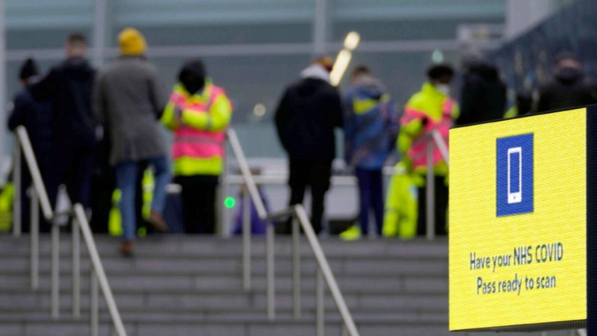 Stewards check the fans for their Covid-19 documents at the entrance of the Tottenham Hotspur Stadium ahead of the English Premier League soccer match between Tottenham Hotspur and Liverpool in London. — AP