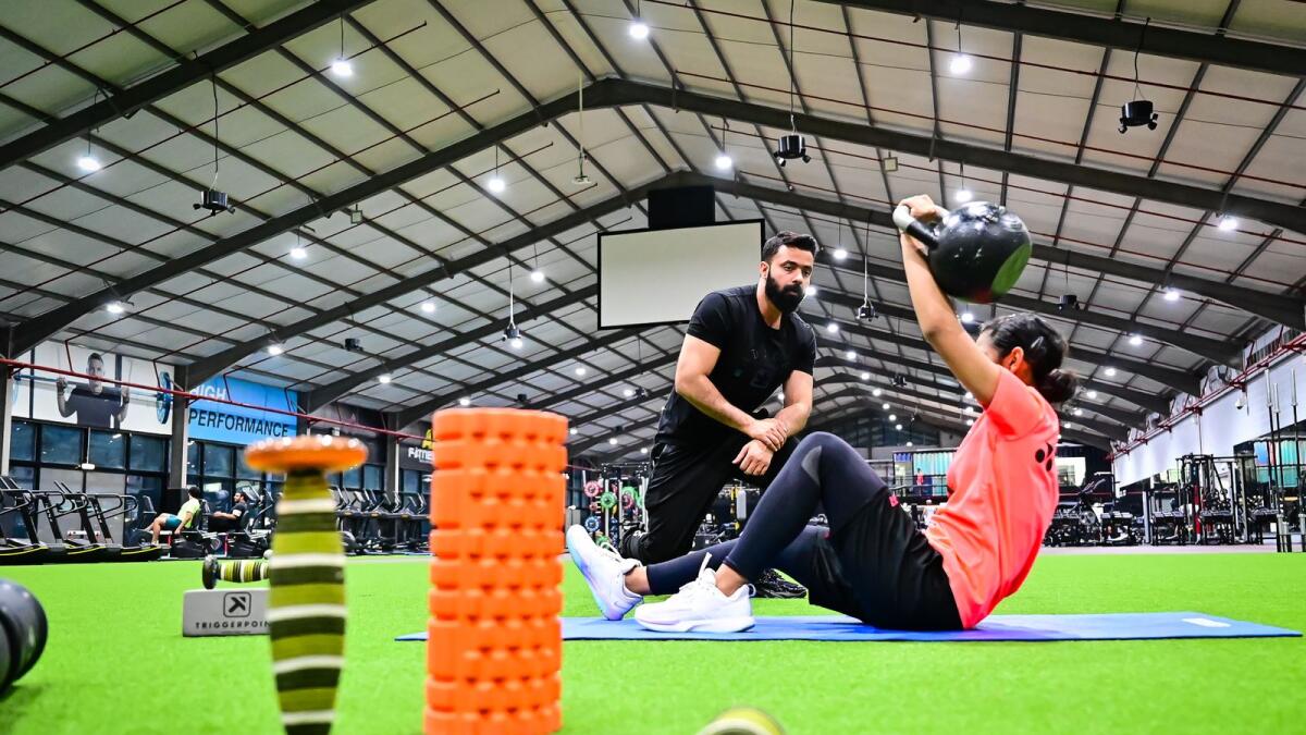 Shahbaz Haider, Personal Trainer coaches Mysha Omer Khan UAE No. 1 in badminton for girls under 15 at AB Fitness in Dubai.  Photo by Neeraj Murali.