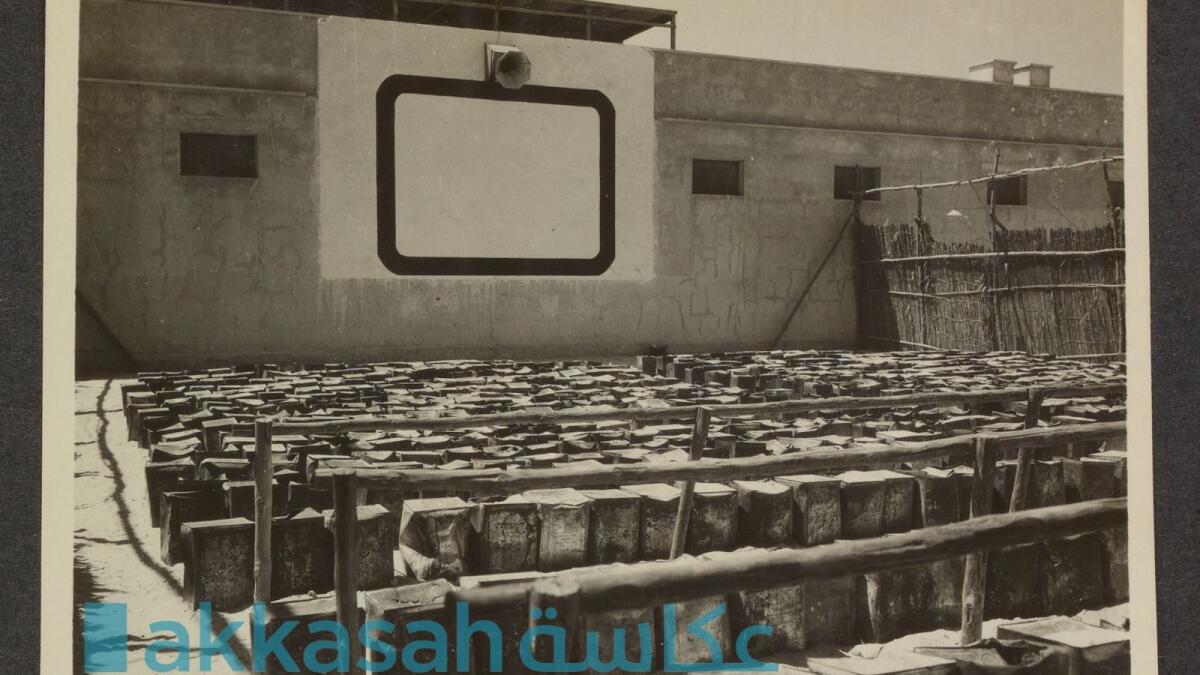 An archival picture of the UAE's first cinema, with rows of tins making up the seats at the open-air venue. Photo: Akkash photographic Archive, ADNYU