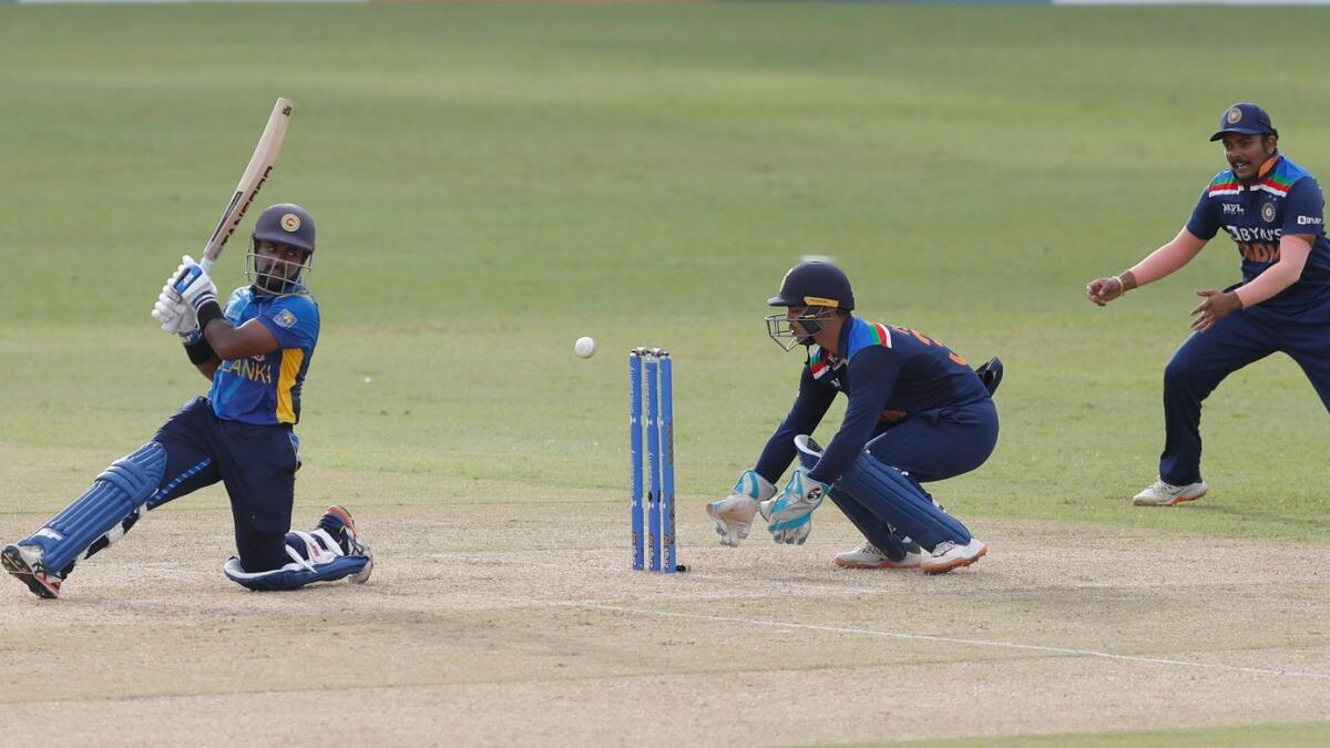 Sri Lanka's Charith Asalanka plays a shot as India's wicketkeeper Ishan Kishan watches. — AP