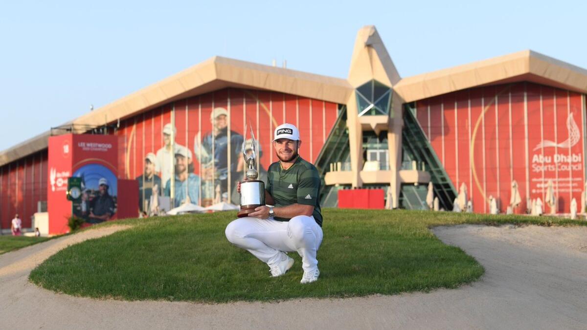 World No.5 Tyrrell Hatton holds the Falcon Trophy after winning the Abu Dhabi HSBC Golf Championship on Sunday. — European Tour Twitter