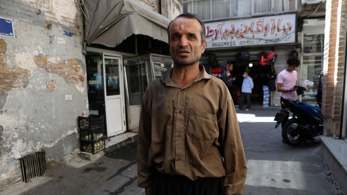 Loqman Karimi, a porter at Tehran’s Grand Bazaar.