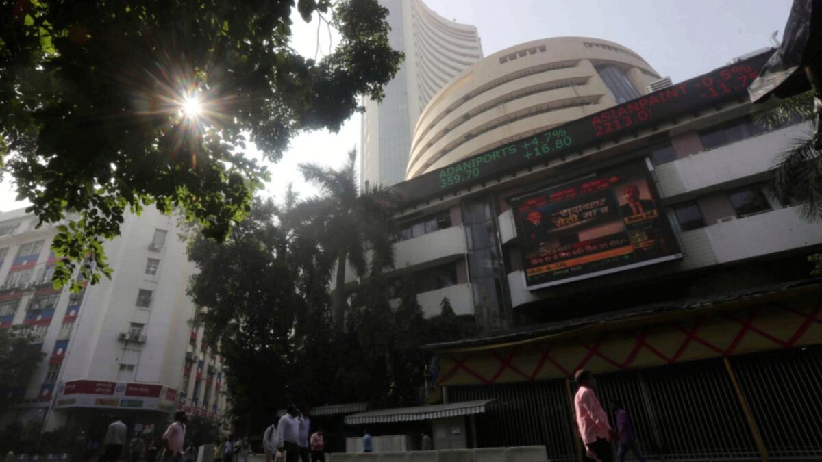 People walk past the Bombay Stock Exchange (BSE) building in Mumbai. — AP file