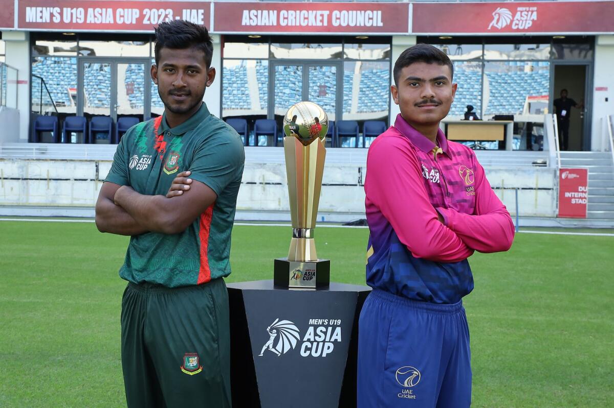 Aayan Afzal Khan (R) and Mahfuzur Rahman Rabby with the Asia Cup U19 trophy at the Dubai International Cricket Stadium. Photo: Asian Cricket Council