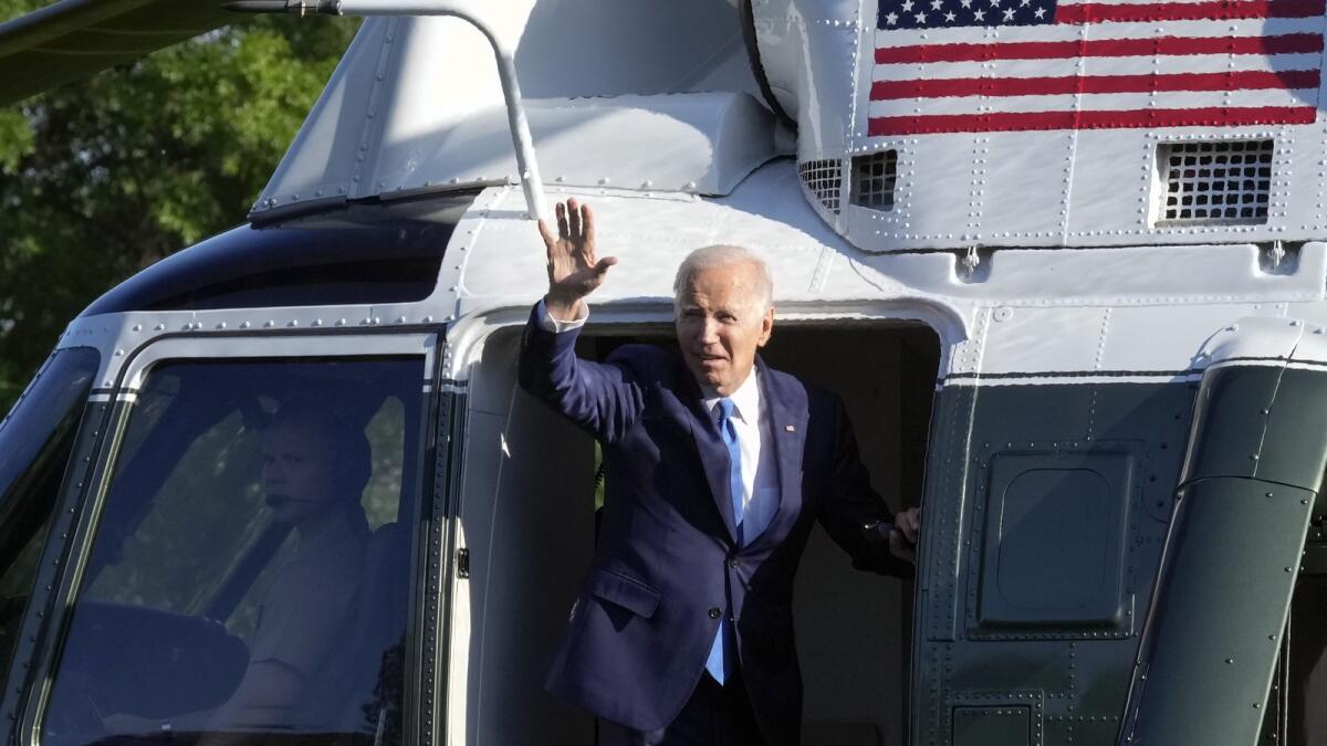 President Joe Biden waves as he boards Marine One on the South Lawn of the White House in Washington on Friday. — AP