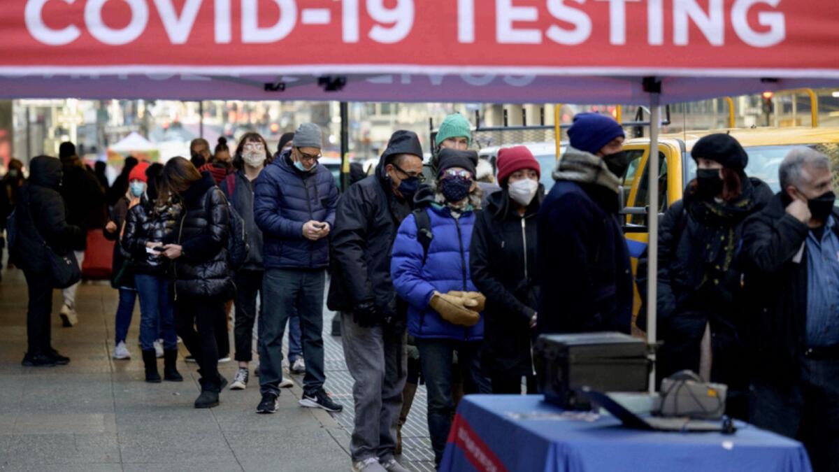 People wait in line to receive a Covid-19 test in New York. — AFP