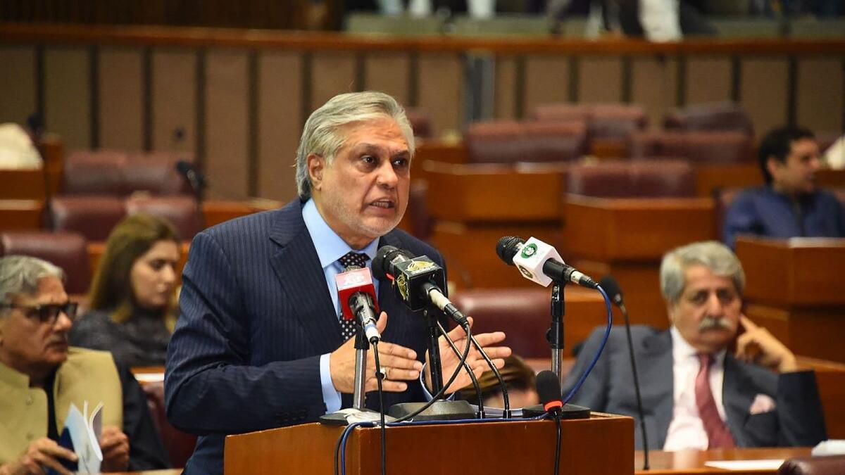 Pakistan's Finance minister Ishaq Dar presenting the budget 2023-2024 in the national assembly in Islamabad. --- AFP