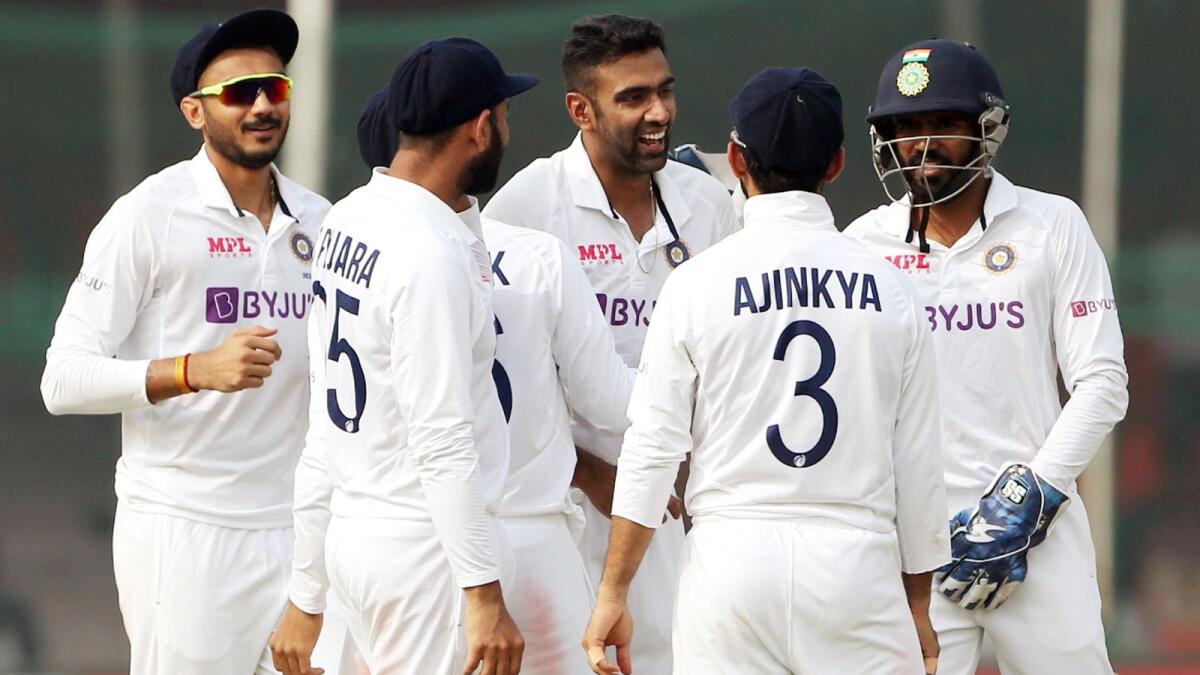 India's R Ashwin (second from right) celebrates the dismissal of New Zealand's Tom Latham on the fifth day of the first Test in Kanpur on Monday. — ANI