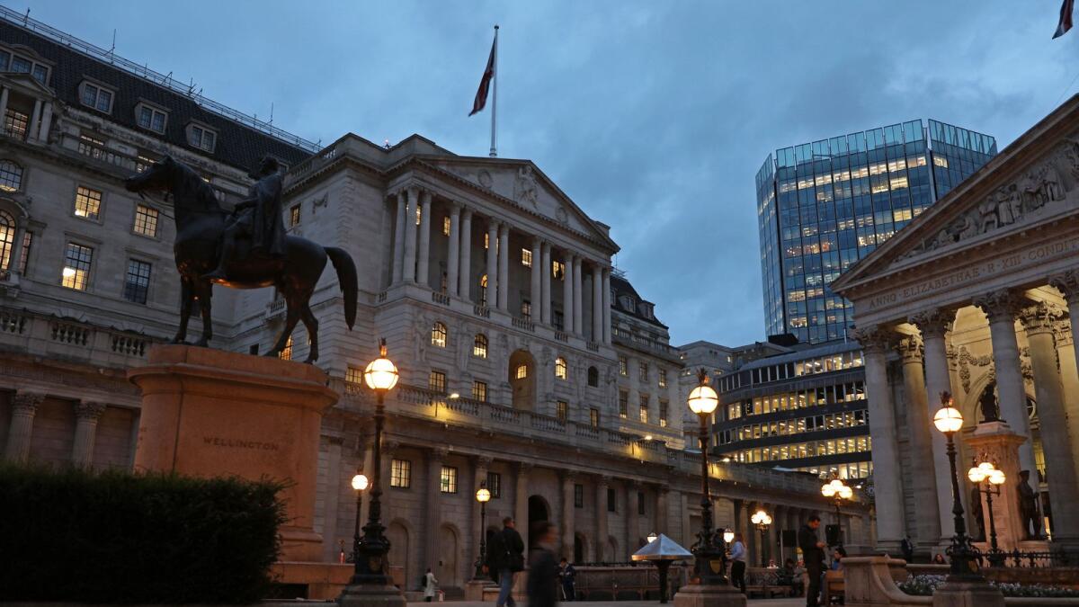 The Bank of England, Britain's central bank, is pictured at dusk in the City of London. — AFP