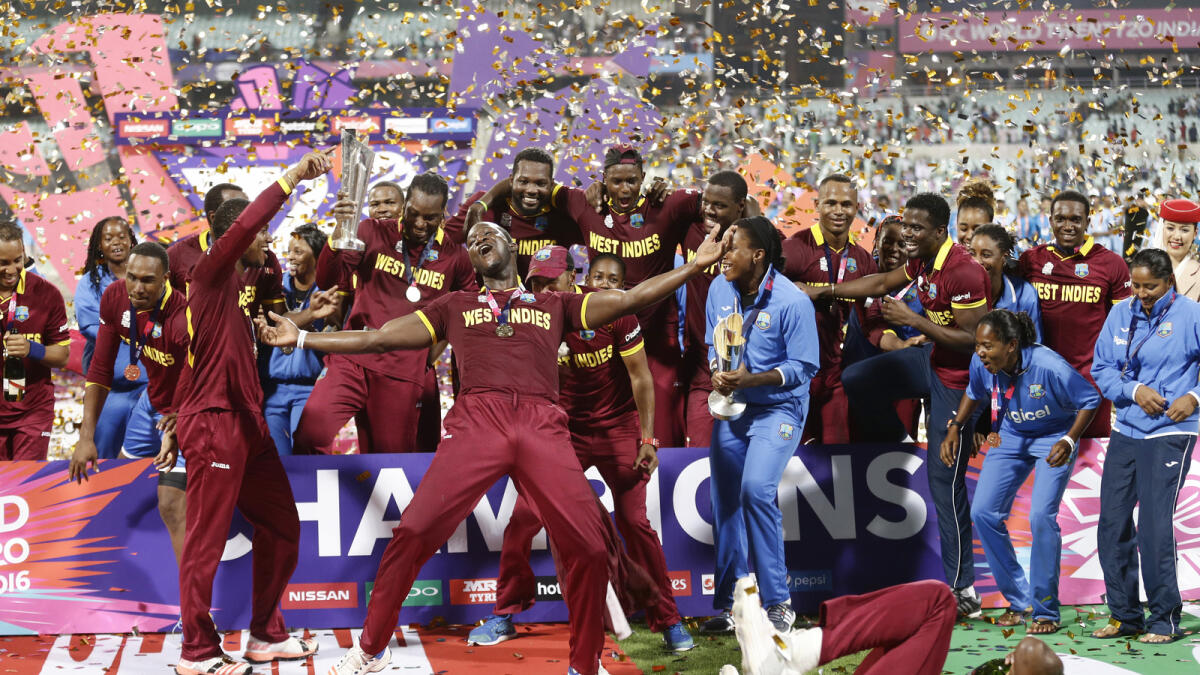 West Indies men's and women's players celebrate after their respective wins in the finals of the ICC World Twenty20 2016 cricket tournament at Eden Gardens in Kolkata, India, Sunday, April 3, 2016.