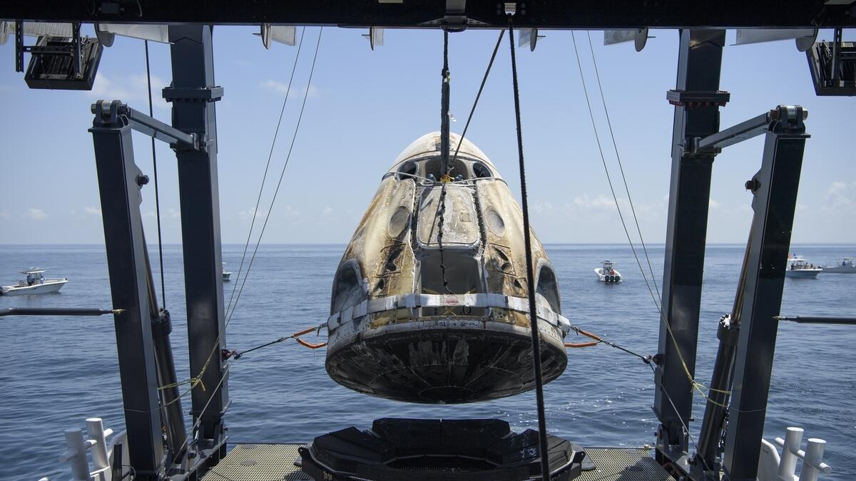 This NASA video frame grab image shows Dragon Endeavour shortly after it was hoisted from the Gulf of Mexico off the cost of Pensacola, Florida on the deck of the SpaceX recovery vessel GO Navigator on August 2, 2020.