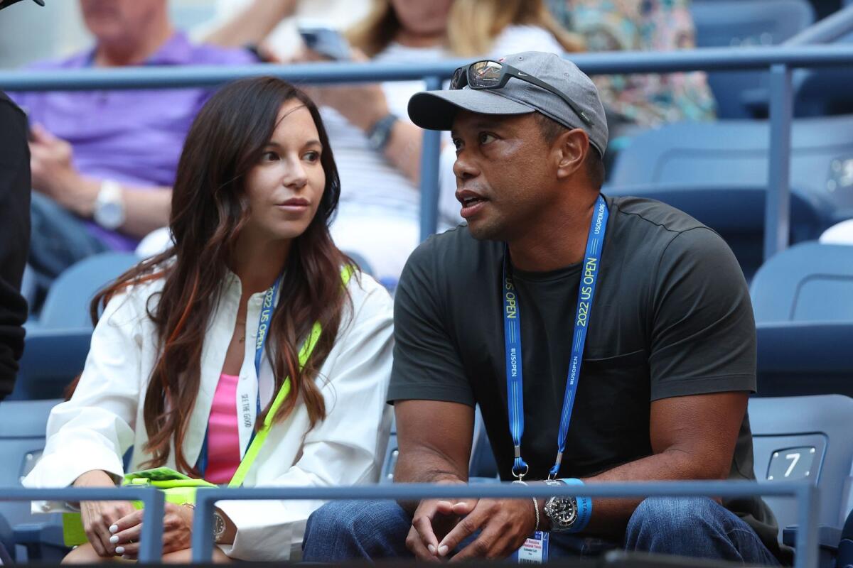 Erica Herman and Tiger Woods lat the 2022 US Open.  A state court filing in Florida spelled out Herman's position on the key piece of evidence. — AFP