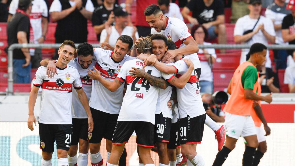 Stuttgart's German defender Marc-Oliver Kempf (third) celebrates with teammates after scoring the 3-0 during the German first division Bundesliga football match between VfB Stuttgart and Greuther Fuerth. — AFP