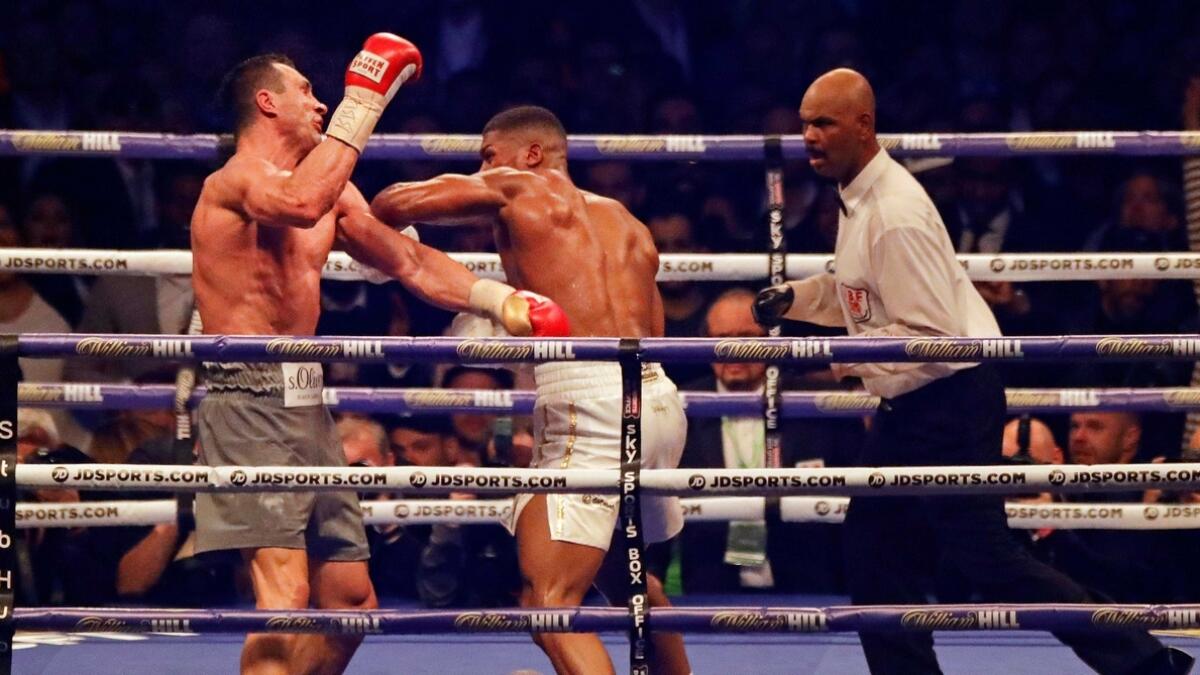 British boxer Anthony Joshua, right, fights Ukrainian boxer Wladimir Klitschko 