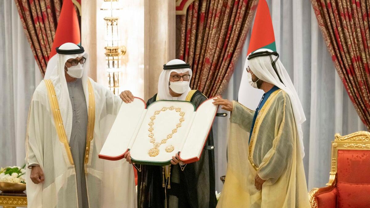 Dr Anwar Gargash (centre) being awarded the with the Order of Union by His Highness Sheikh Mohammed bin Rashid Al Maktoum, Vice-President and Prime Minister of the UAE and Ruler of Dubai (right) and His Highness Sheikh Mohamed bin Zayed Al Nahyan, Crown Prince of Abu Dhabi and Deputy Supreme Commander of the UAE Armed Forces.