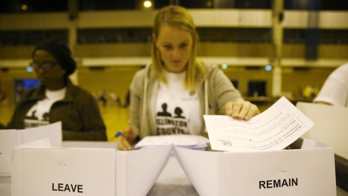 A workers counts ballots after polling stations closed in the Referendum on the European Union in Islington.