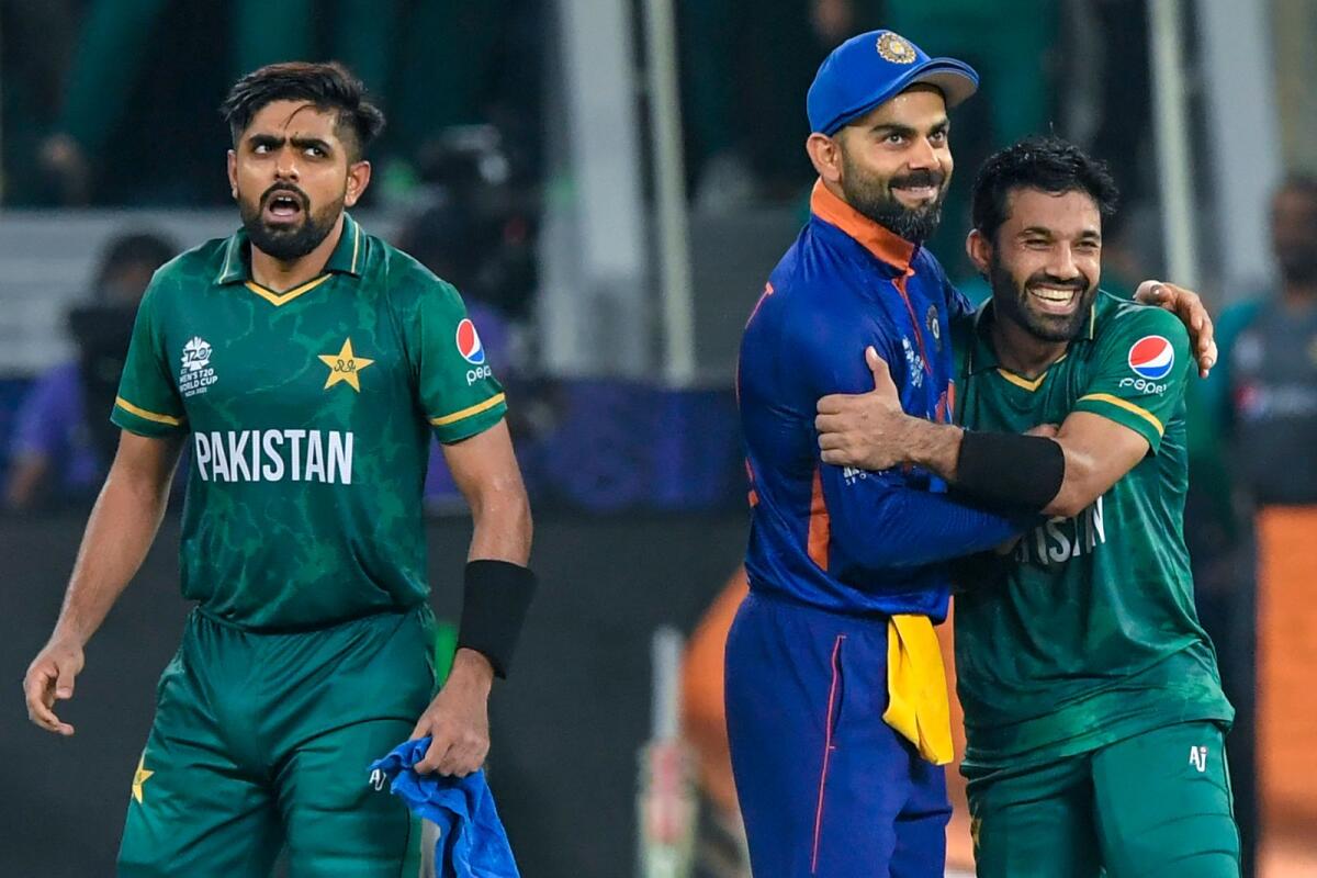 India's Virat Kohli (centre) congratulates Mohammad Rizwan (right) as Babar Azam looks on during the ICC 2021 T20 World Cup at the Dubai International Cricket Stadium. — AFP file