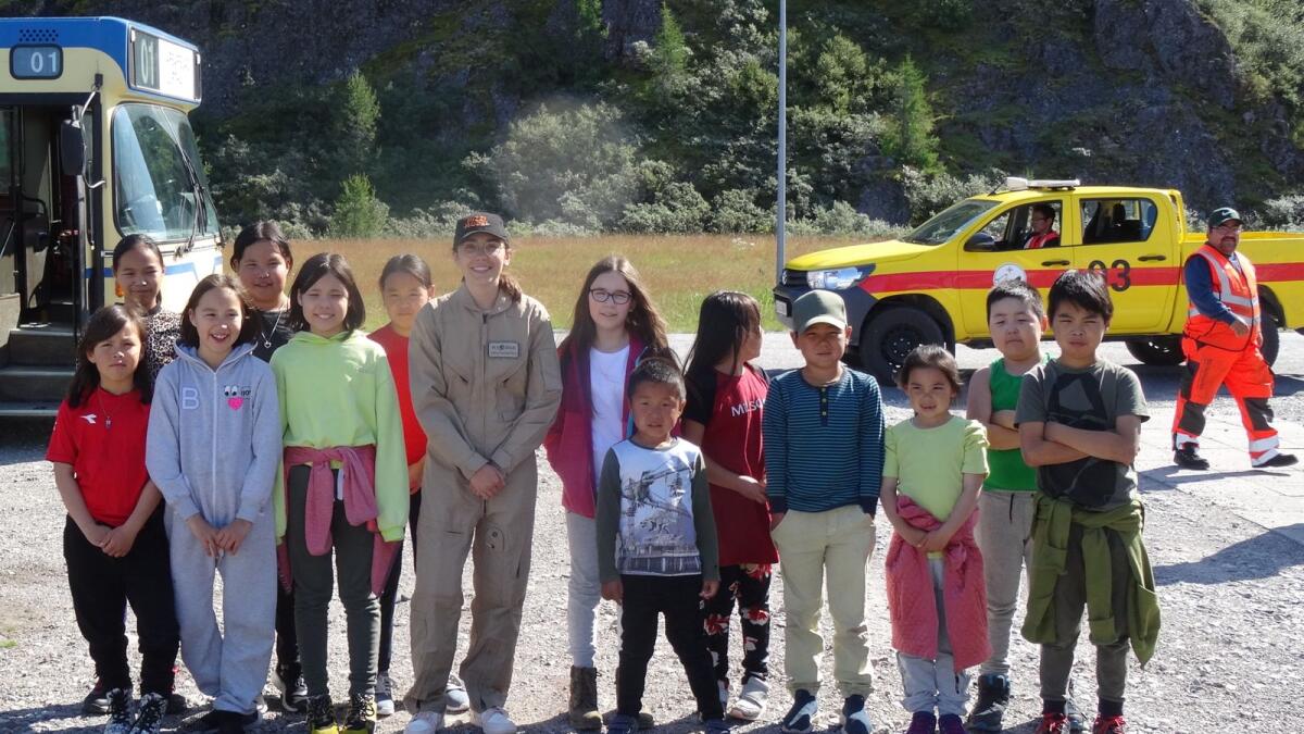Rutherford with local children after landing at Narsarsuaq, Greenland. August 2021.