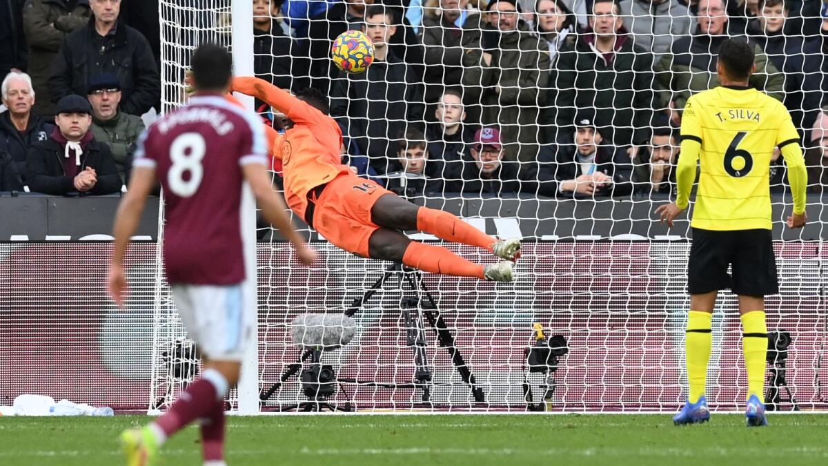 West Ham United's French defender Arthur Masuaku (not in picture) scores his team's third goal past Chelsea goalkeeper Edouard Mendy (centre) during the English Premier League match. (AFP)