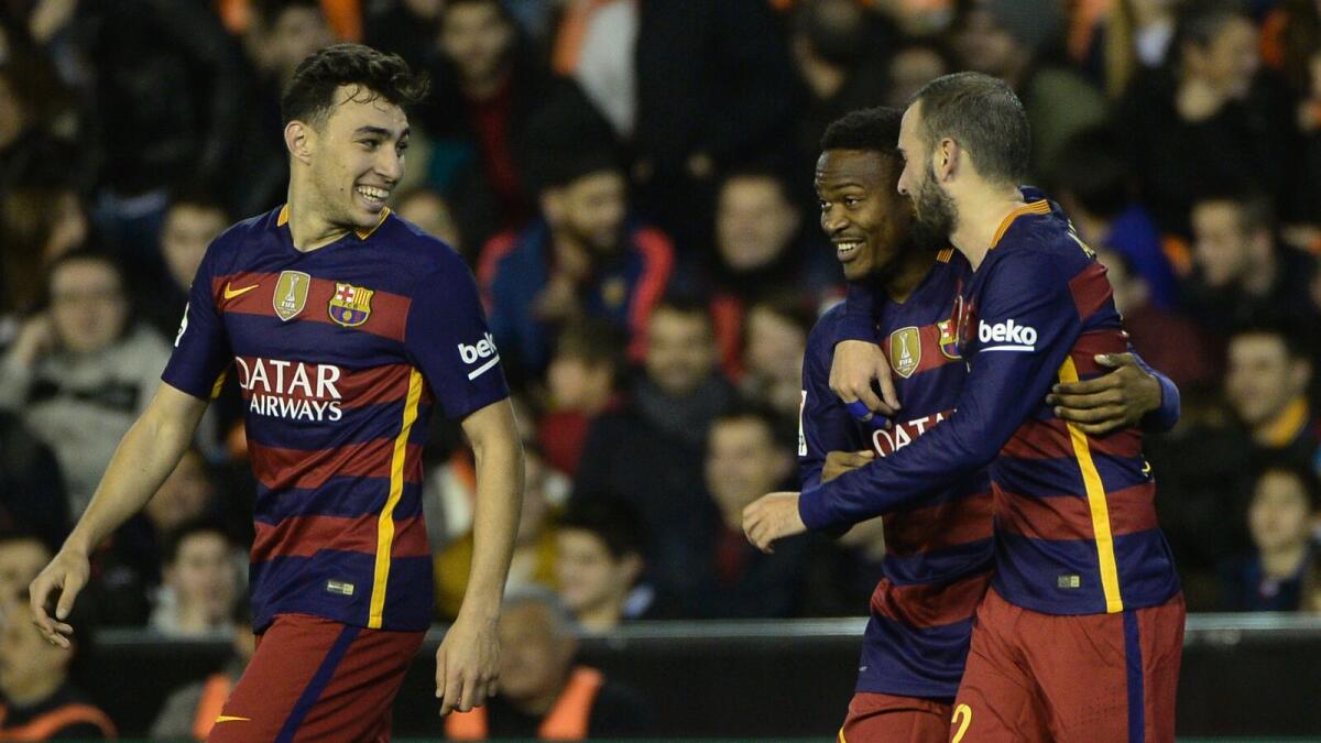 Barcelona’s  forward Wilfrid Kaptoum (centre) celebrates his goal with defender Vidal Aleix and forward Munir El Haddadi (left). — AFP