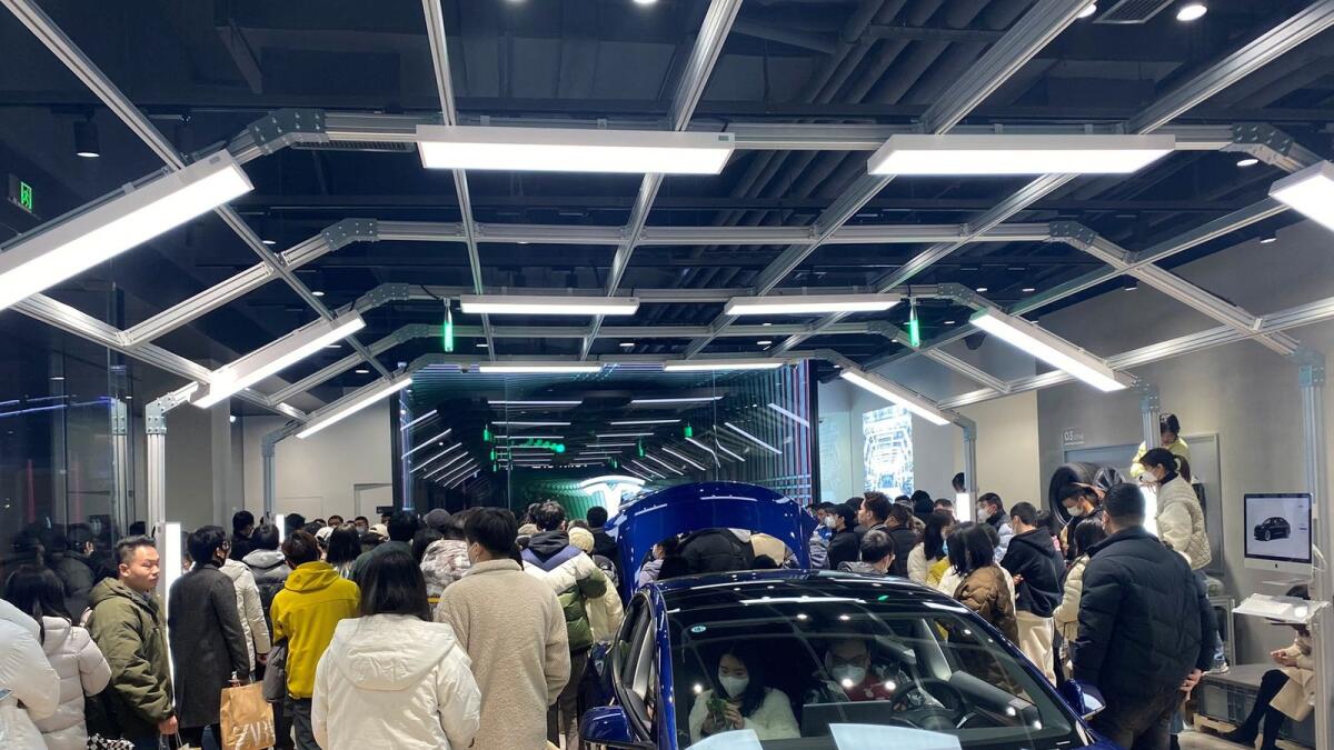 People protest at a Tesla showroom in Chengdu, Sichuan, China, released January 6, 2023 in this picture obtained by Reuters from social media. /via REUTERS THIS IMAGE HAS BEEN SUPPLIED BY A THIRD PARTY. NO RESALES. NO ARCHIVES.