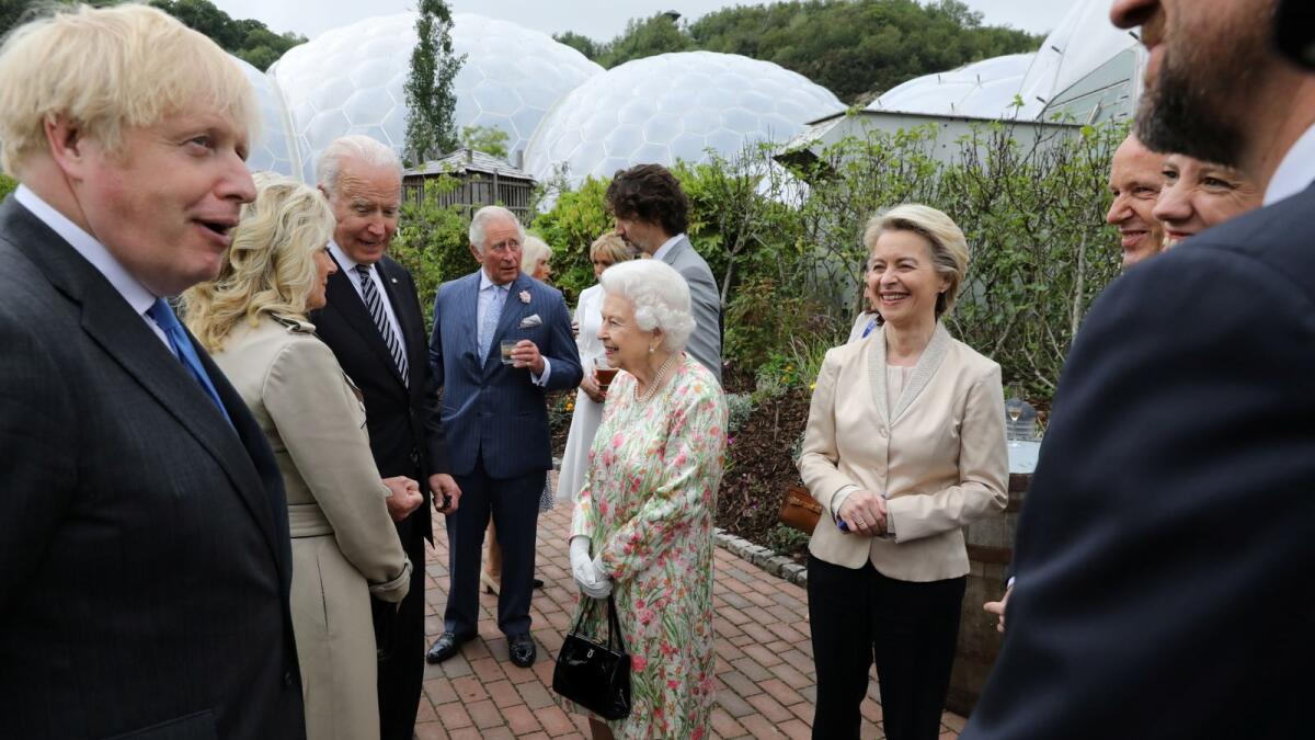 Britain's Prime Minister Boris Johnson, US President Joe Biden and his wife Jill Biden, European Commission President Ursula von der Leyen and Canada's Prime Minister Justin Trudeau along with Britain's Queen Elizabeth and Prince Charles attend a  reception on the sidelines of the G7 summit, at the Eden Project in Cornwall, Britain, on Friday.