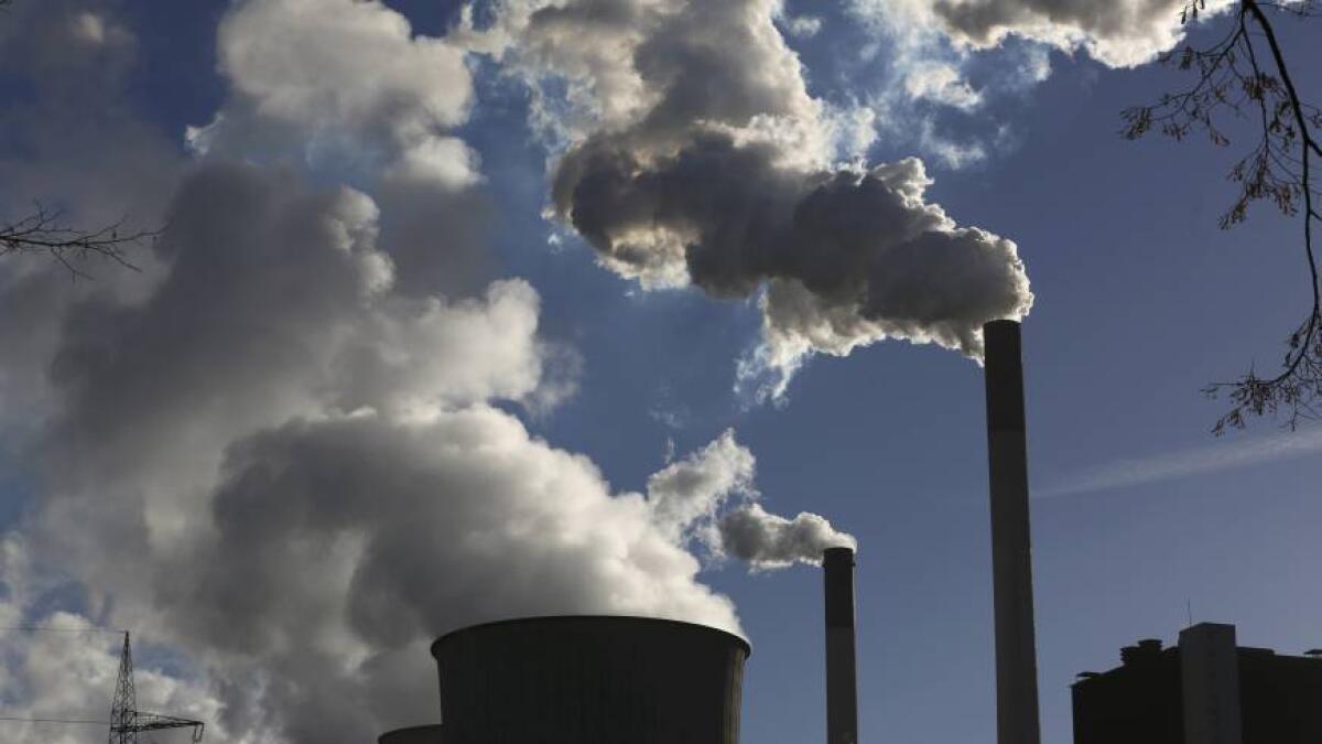 Calderon allays fears over carbon emission controls