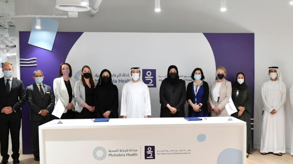 Officials from Mubadala Health and Abu Dhabi Early Childhood Authority after signing the agreement. — Supplied photo