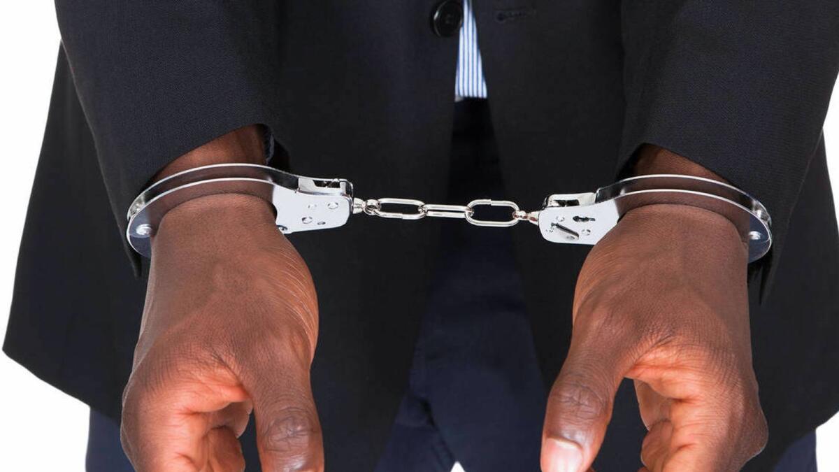 KDBW6F African Man With Handcuffed Hands Isolated On White Background