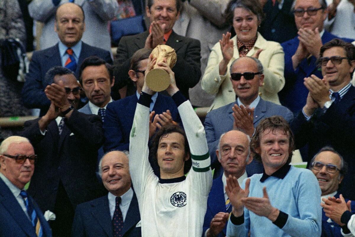 West Germany captain Franz Beckenbauer lifts the World Cup trophy on July 7, 1974. — AP file